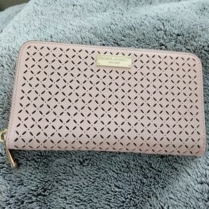 Henri Bendel pink perforated continental wallet